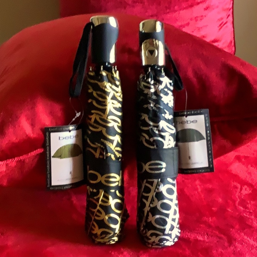 Bebe monogrammed umbrella. Only Black & Gold available.